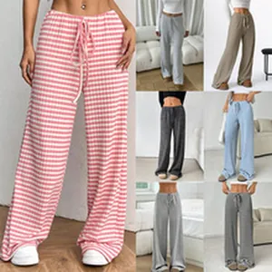 Stylish women's wide leg lounge pants featuring drawstring waist and pink striped pattern