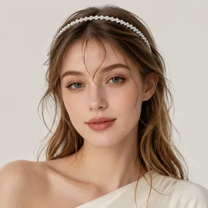 Elegant silver rhinestone headband worn by a model for a chic luxury fashion look.