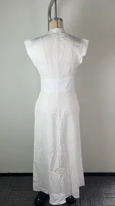 Detailed back view of an elegant white stand collar maxi dress with chic flutter sleeves.
