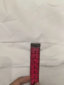 Measurement detail of the soft white fabric for elegant solid color summer dress