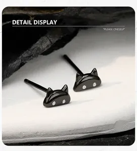 Detailed view of minimalist black cat stud earrings crafted from S925 sterling silver