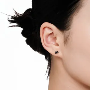 Cute S925 sterling silver black cat stud earrings shown worn on ear for minimalist style