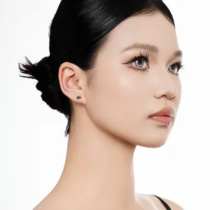 Professional shot of minimalist S925 silver black cat stud earring on Asian female model