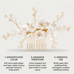 Detail view of a handmade bridal hair comb with white clay flowers and delicate pearls
