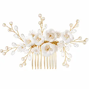 Handmade bridal hair comb with elegant white clay flowers and pearls on gold wire