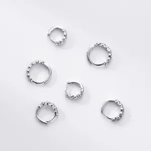 Detail of S925 sterling silver hoop earrings with sparkly cubic zirconia stones in multi sizes