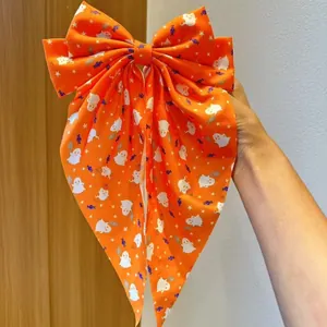 Gros nœud pour cheveux Halloween orange avec motifs mignons de fantôme et citrouille.