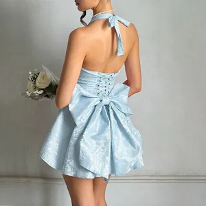 Elegant back detail of light blue jacquard halter dress with a large decorative bow