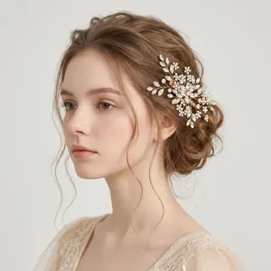 Elegant detail showing a vintage handmade rhinestone leaf hair clip on professional bridal hairstyle
