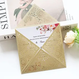 Detail shot of a glitter gold laser-cut wedding invitation with lace patterns