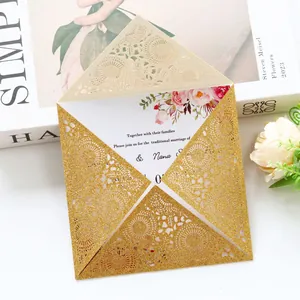 Elegant gold laser-cut wedding invitation with glitter finish and floral printed insert