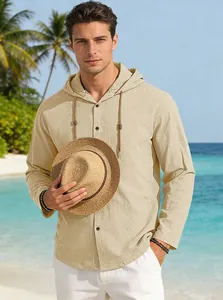 Professional male model wearing a breathable beige hooded long-sleeve shirt on a tropical beach