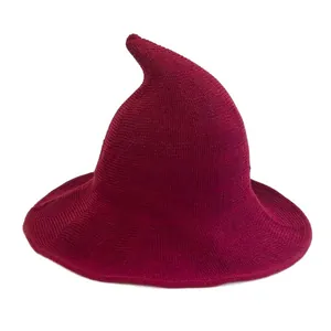 Handcrafted burgundy knitted witch hat with a curved pointy top for Halloween parties