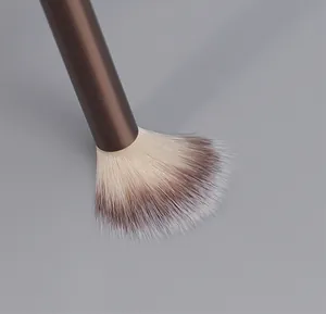 Macro detail of soft bicolored synthetic bristles on a professional makeup fan brush