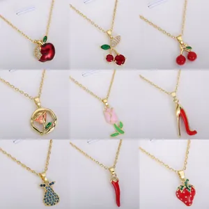 Grid view of various fruit and object necklaces including cherries, apple, and tulip pendants