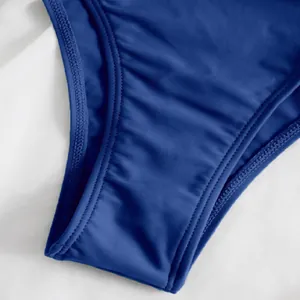 Close-up detail of blue one-shoulder swimsuit with professional double stitching