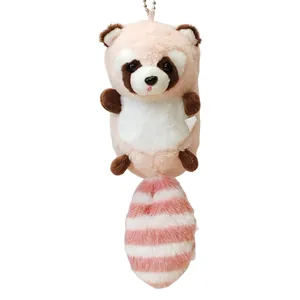 Lindo llavero de peluche de mapache rosa con una suave cola a rayas para bolsos.