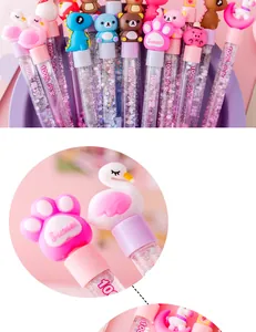 Detail view of cute cartoon liquid glitter pens with colorful sequins and charms