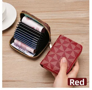 Detailed view showing the multi-slot interior of a red geometric pattern card wallet