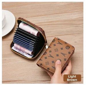 Detail view of light brown multi-slot card holder with zip closure