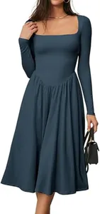 Model wearing a blue square neck long sleeve pleated dress with a black handbag