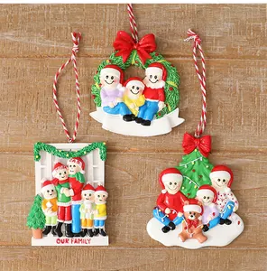Detailed view of three unique family-themed resin Christmas tree hanging ornaments