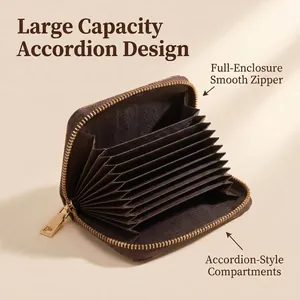 Detail view of the accordion-style card slots and smooth zipper on a brown wallet.