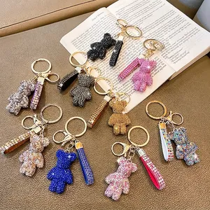 Macro detail of rhinestone-encrusted bear keychains in multiple vibrant colors