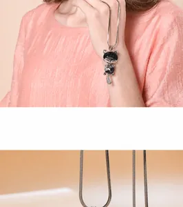 Elegant cat-shaped black crystal pendant on a long silver snake chain necklace