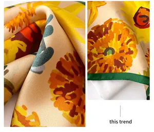 High-resolution detail of vintage sunflower pattern on a soft mulberry silk scarf