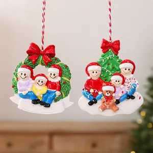 Close-up of colorful resin family Christmas ornaments for festive tree decoration