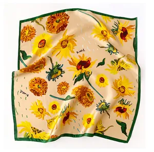 Detailed view of silk square scarf featuring vibrant sunflower prints in Van Gogh style.