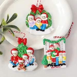 Personalized family resin Christmas tree ornaments with festive bows and strings