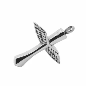 Detail view of vintage stainless steel cross urn pendant with wing design