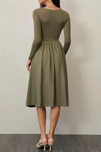 Back view detail of a chic long-sleeved olive green pleated midi dress for autumn wear