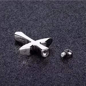 Stainless steel cross cremation urn pendant for ashes with screw top opening detail