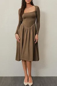 Elegant brown square neck long sleeve pleated midi dress shown on model in studio