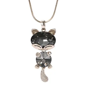 Elegant rose gold cat pendant necklace with faceted grey crystals and paved tail detail.