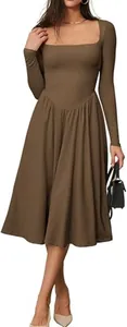 Full body view showing the elegant square neck and pleated skirt of a brown dress