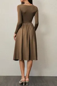 Back view of an elegant long-sleeved pleated A-line dress in solid brown with a slim fit