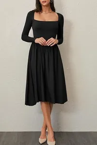 Detail view of women's black long-sleeve dress with elegant square neckline
