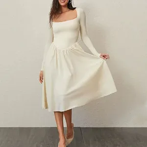 Elegant ivory long-sleeved dress with square neckline and pleated midi skirt