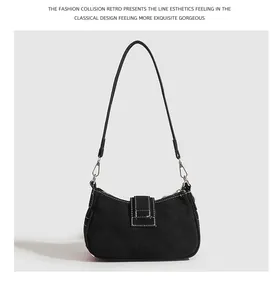 Élégant sac sous l'aisselle y2k noir avec surpiqûres contrastées blanches et ferrures