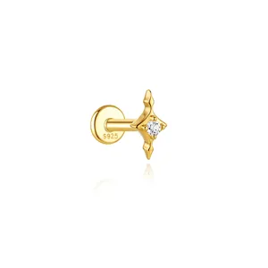 Detailed view of a gold-plated sterling silver star stud earring with a clear gemstone.