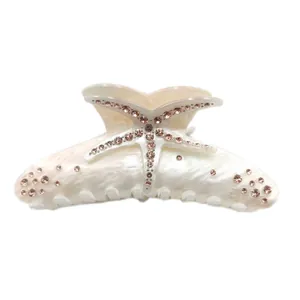 Elegant pearlescent marble acetate hair claw clip featuring pink rhinestone starfish decoration