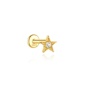 Macro view of a gold-plated S925 silver star ear stud with a central clear zircon stone