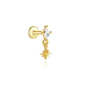 Detailed macro view of S925 gold-plated ear bone stud with star and diamond stone