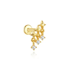 Close-up of gold S925 sterling silver star labret earring with sparkling stone tassels