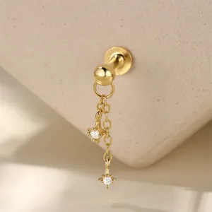 Macro view of gold S925 sterling silver star chain tassel flat-back labret stud