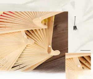 Detailed macro view of delicate hollow patterns on natural bamboo folding fan ribs